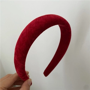 Detail view of thickened red velvet headband with vintage rhombic pattern design