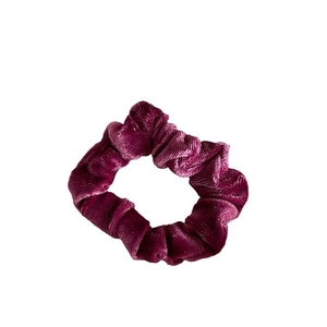 Lustrous burgundy velvet scrunchie for women with soft texture and elastic design