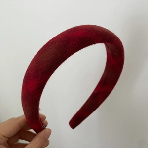 Detailed view of red checkered quilted thick headband with soft fuzzy texture fabric