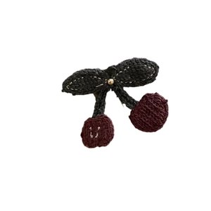 Handmade knitted cherry hair accessory with red yarn fruit, green leaves and gold bead