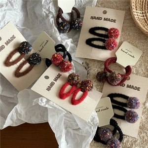 Handmade colorful pom pom hair clips and ties set for women and girls on display cards