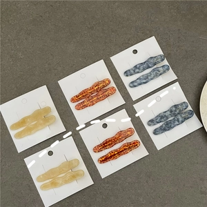Barrettes à cheveux ondulées en acétate avec motifs écaille de tortue et marbre