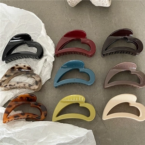Elegant hollow heart hair claw clips set in nine assorted colors and tortoiseshell patterns
