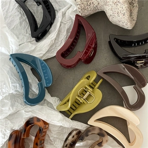 Elegant hollow heart hair claws in assorted matte colors and classic tortoise patterns