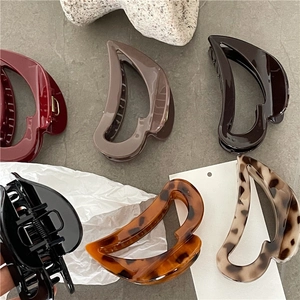 Detailed set of large hollow heart hair claws in six colors with glossy resin finish