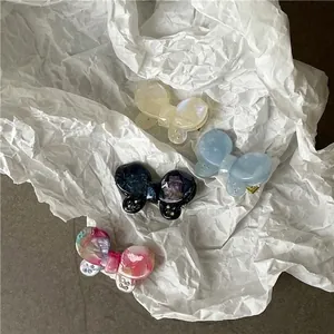 Iridescent acetate butterfly hair clips with sparkling rhinestones in assorted colors