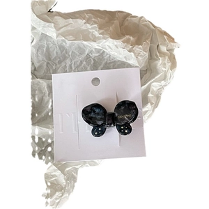 Iridescent butterfly hair clip in dark marble acetate with pearl and gold accents
