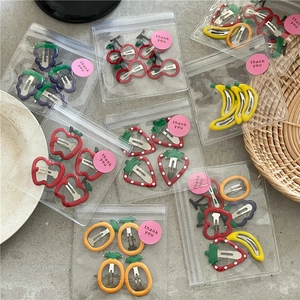 Colorful fruit shaped metal hair clips set with strawberry and banana patterns