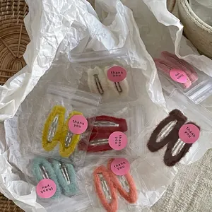 Plush teardrop snap hair clips set in various cream colors with cute thank you packaging