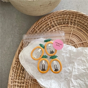 Set of 4 pineapple hair clips with yellow enamel finish in packaging with thank you label