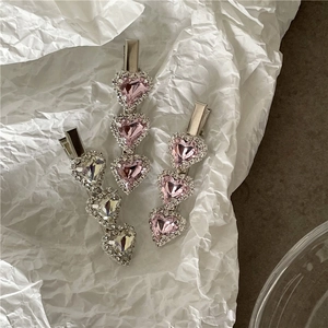Three-piece set of heart-shaped rhinestone hair clips with pink and iridescent crystals