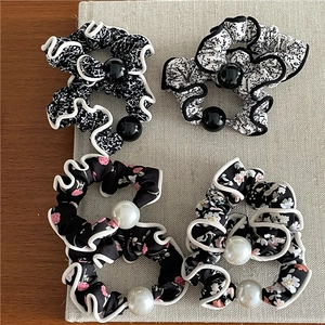 Floral print chiffon scrunchies set with pearl accents for elegant ponytail styling