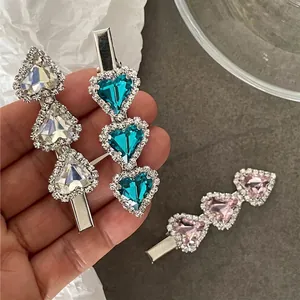 Elegant rhinestone heart hair clips in white, blue, and pink colors for women