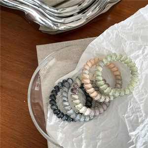 Five-piece marble texture spiral hair ties in Morandi colors with pearlescent finish