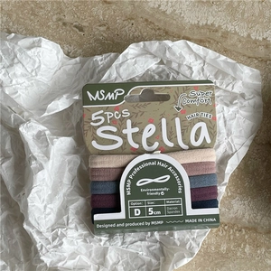 Detail view of five multi-colored elastic hair ties made of high-quality dacron spandex