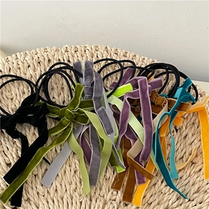 Colorful velvet bow hair scrunchies with long ribbons for elegant ponytail styling
