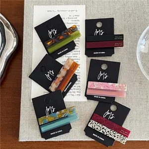 Set of colorful rectangular acetate hair clips with marble and leopard print patterns