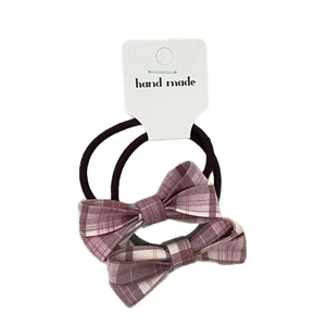 Set of 2 purple plaid bow hair ties on display card with handmade text for girls