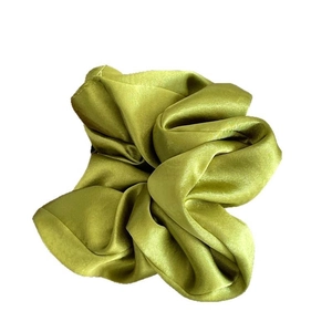 Premium grass green satin silk scrunchie with glossy finish and elegant pleated design