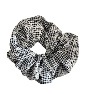 Plaid lace scrunchie with black and white checkered fabric and floral embroidery