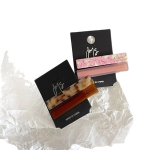 Set of four colorful acetate geometric rectangular hair clips with marble and tortoise texture