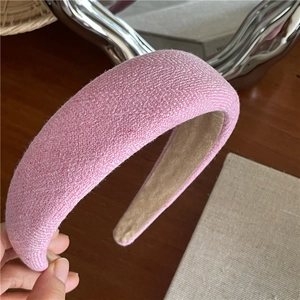 Close-up of pink thickened fabric headband with soft textured sponge padding for girls