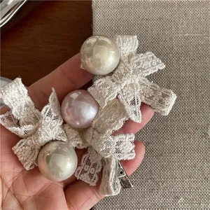 Elegant lace bow hair clips with faux pearls and metal duckbill clips for women