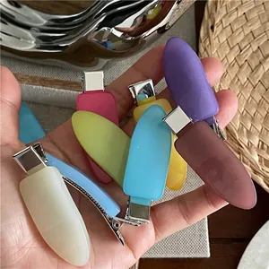 Set of seven colorful matte resin waterdrop hair clips in vibrant jelly colors