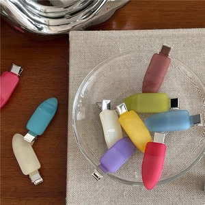 Detail of colorful jelly acrylic duckbill hair clips with silver metal grip in various shades