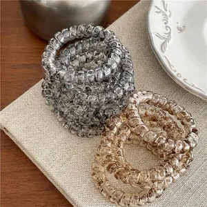 Élastiques spirales pour cheveux à motif léopard dans les tons gris et marron