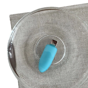 Sky blue jelly resin waterdrop hair clip with silver metal grip on linen fabric