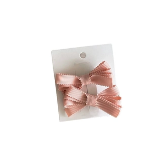 Set di fermagli per capelli con fiocco in nastro grosgrain rosa per bambina color crema