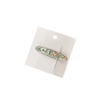 Elegant thick acetate hair clip with vintage marble texture in green and cream tones
