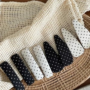 Polka dot hair clip set with black and white drop-shaped and rectangular snap clips