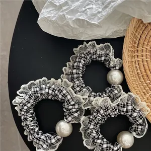 Three-piece set of black and white plaid hair scrunchies with white faux pearls and lace trim