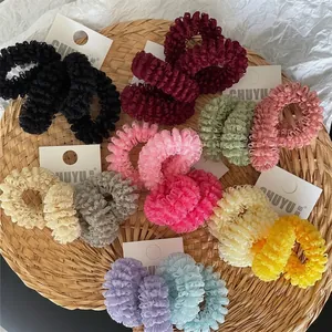 Set of colorful pleated mesh hair scrunchies in vibrant tones for ponytail styling