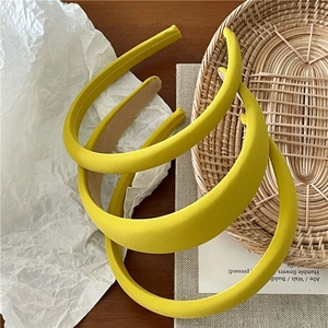 Three-piece vibrant yellow sponge headbands with textured fabric and non-slip lining