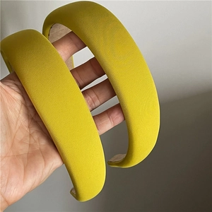 Detailed macro view of vibrant yellow twill fabric texture on thick padded headbands