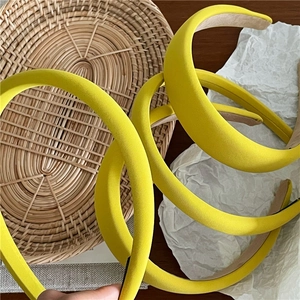 Fashionable bright yellow twill fabric padded headband for women featuring soft texture