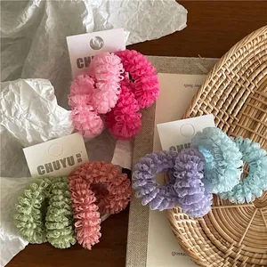 Colorful mesh ruffle scrunchies set in various pastel shades for ponytail hairstyles