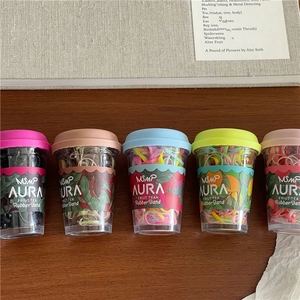 Close-up of colorful high-elasticity hair bands in creative fruit tea cup packaging