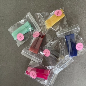 Colorful rectangular jelly resin hair clips in assorted shades in individual packaging