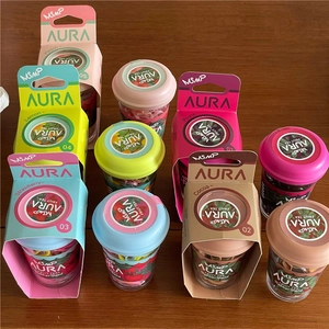 Close-up of colorful high-elastic hair ties in fruit-themed cup packaging on wood