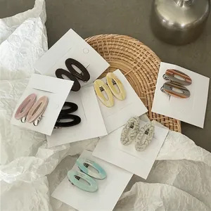 Barrettes à cheveux ovales en acétate avec motifs marbrés et couleurs variées