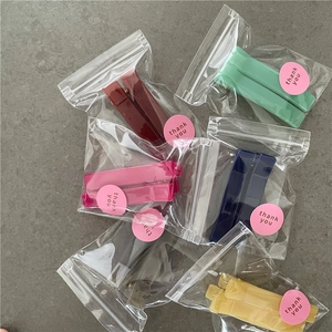 Set of six colorful rectangular hair clips individually wrapped with thank you stickers