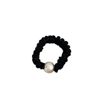Elegant black satin scrunchie with a large white pearl bead for hair styling