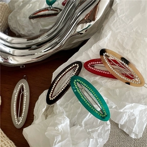 Elegant oval acetate hair clips with micro-set rhinestones in multiple assorted colors