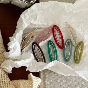 Luxe acetate hair clips with rhinestones in various colors like red, pink and green