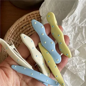 Cute cream colored wave dot hair clips set in macaron blue and yellow shades