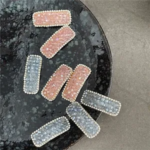 Sparkling rectangular rhinestone hair clips in pink and grey blue with crystal beads